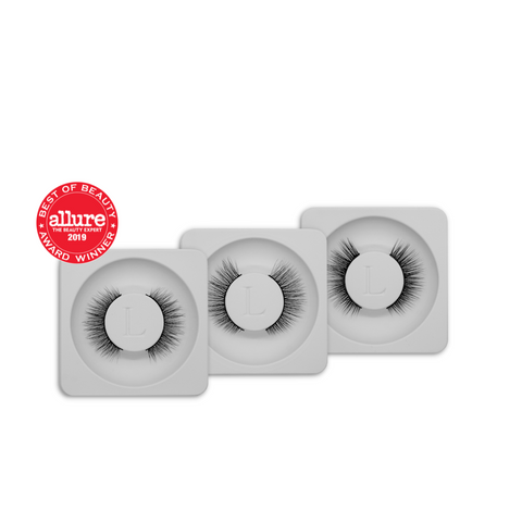 Lithe Lashes Bundle Deal Collections, Core Best Sellers Bundle, a product image of three lash styles, 01 Fine & Delicate, 03 Everyday Winged, and 06 Natural & Classic, bundled together for a deal worth 25% off, all three lashes are stacked one next to each other from left to right, in their grey tray packaging with the Allure best of beauty seal in the top left of the image, all on a white background.