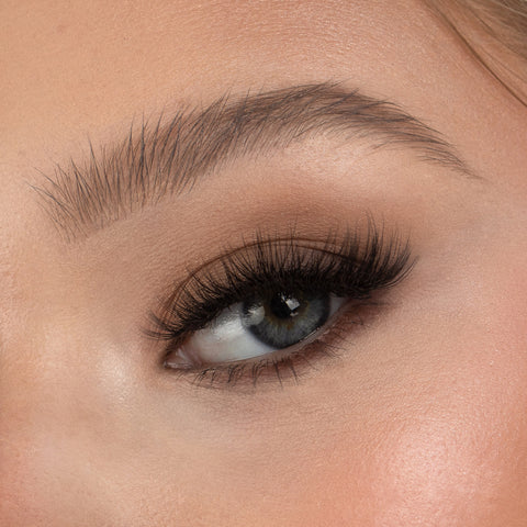 Lithe Lashes Bold Collection Style B1 - Tapered & Winged, a close up eye thumbnail image of the model's eye wearing the false lashes for an up close perspective on how elegant the falsies look on the eye.