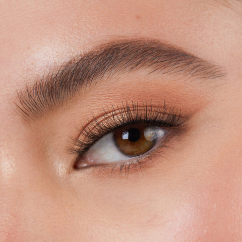 Lithe Lashes Core Collection lash style named 01 Fine and Delicate, a close up eye thumbnail image of the model's eye wearing the false lashes for an up close perspective on how elegant the falsies look on the eye.