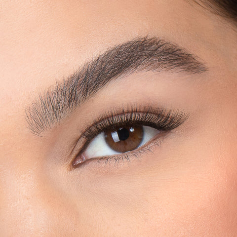 Lithe Lashes, Nude Collection, N1 Minimally Winged, a close up eye thumbnail image of the model's eye wearing the false lashes for an up close perspective on how elegant the falsies look on the eye.
