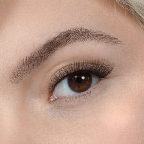 Lithe Lashes, Nude Collection, N4 - Semi Flared, a close up eye thumbnail image of the model's eye wearing the false lashes for an up close perspective on how elegant the falsies look on the eye.
