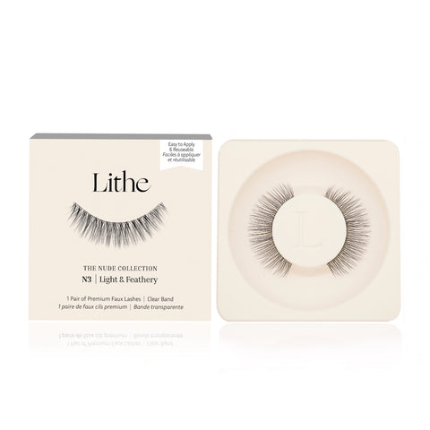 Lithe Lashes Nude Collection Style N3 Light & Feathery product image with a single pair of false eyelashes resting in their cream coloured biodegradable plastic tray on right side of the image, and on the left side of the image is the cream coloured paper sleeve showing a high definition image of a single lash on the front, with the logo in the centre and in the upper right the callouts of easy to apply and reusable.