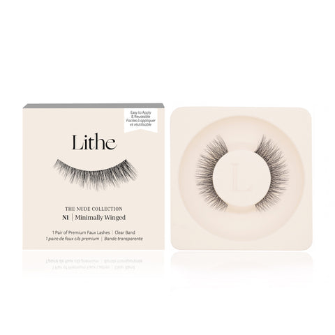 Lithe Lashes Nude Collection Style N1 Minimally Winged, product image with a single pair of false eyelashes resting in their cream coloured biodegradable plastic tray on right side of the image, and on the left side of the image is the cream coloured paper sleeve showing a high definition image of a single lash on the front, with the logo in the centre and in the upper right the callouts of easy to apply and reusable.