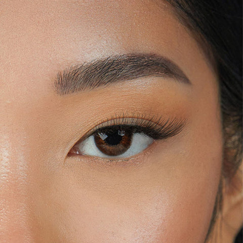Lithe Lashes Mini Lashes lash style named M2 - Mini Winged, an image of a model's left eye wearing the falsies, showing how natural and beautiful they look.